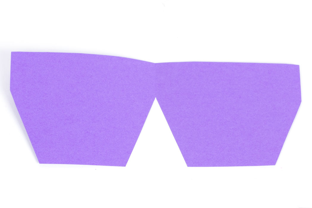 Step 1 Pick the colour that you want the plant pot to be and fold it in half. Then cut out the shape of a plant pot - leaving about an inch on the folded side so it stays in one piece. When opened the card should be a similar shape to the one in the image above.