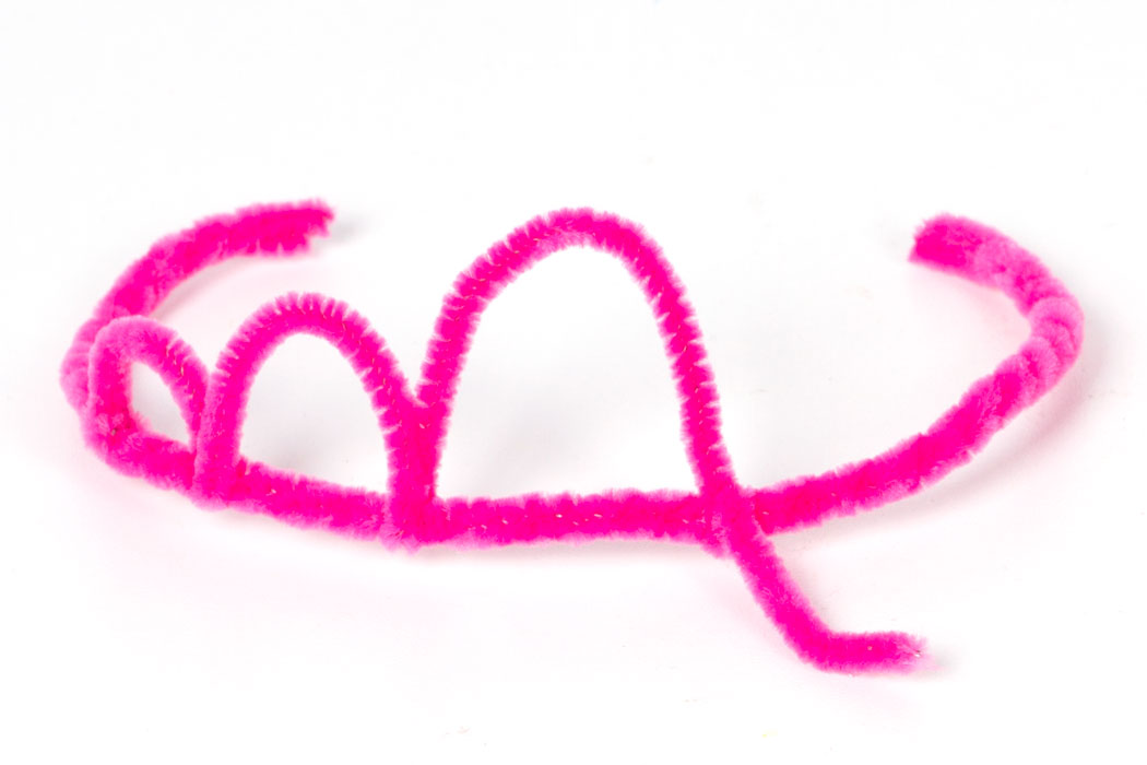 Step 2 Take another pink pipe cleaner and bend the end tightly around the headband. Then bend into a loop and fold around the headband again to keep it in place. Repeat this until you have the full tiara shape.