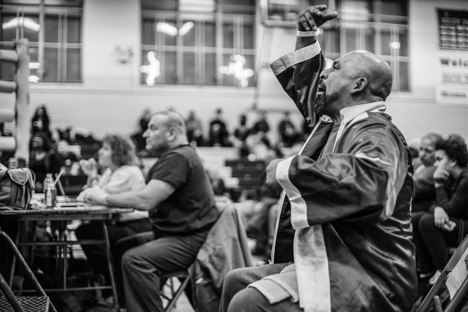 "That's it baby! Left jab!" Aureliano Sosa, head coach at Flatbush Gardens boxing club, giving advice from the corner at Shu Shu's fight in Holy Cross High School, Queens on March 6, 2015.
