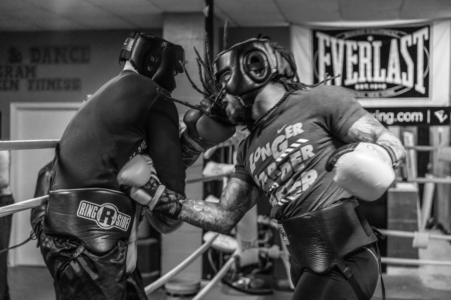 Two local men spar with each other. The club has great camaraderie where all people are welcome. "We struggling man", says Nate. "The cost of heating this place, the upkeep of the gym, simple things, it all costs money."