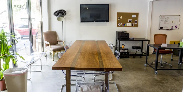 Vivian's production office with desks, monitor and whiteboard