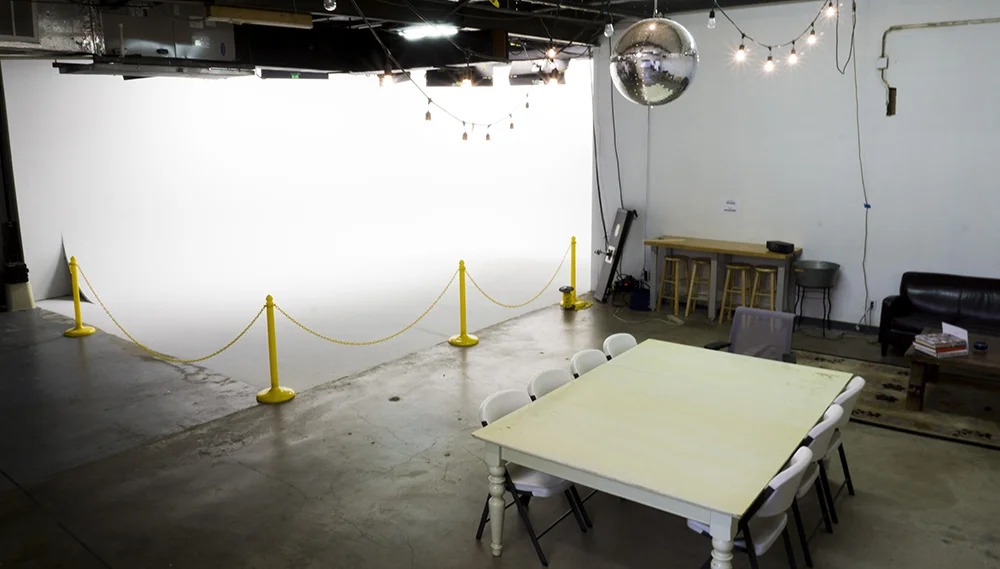 Wide view of the stage with the cyc, stanchions and production tables