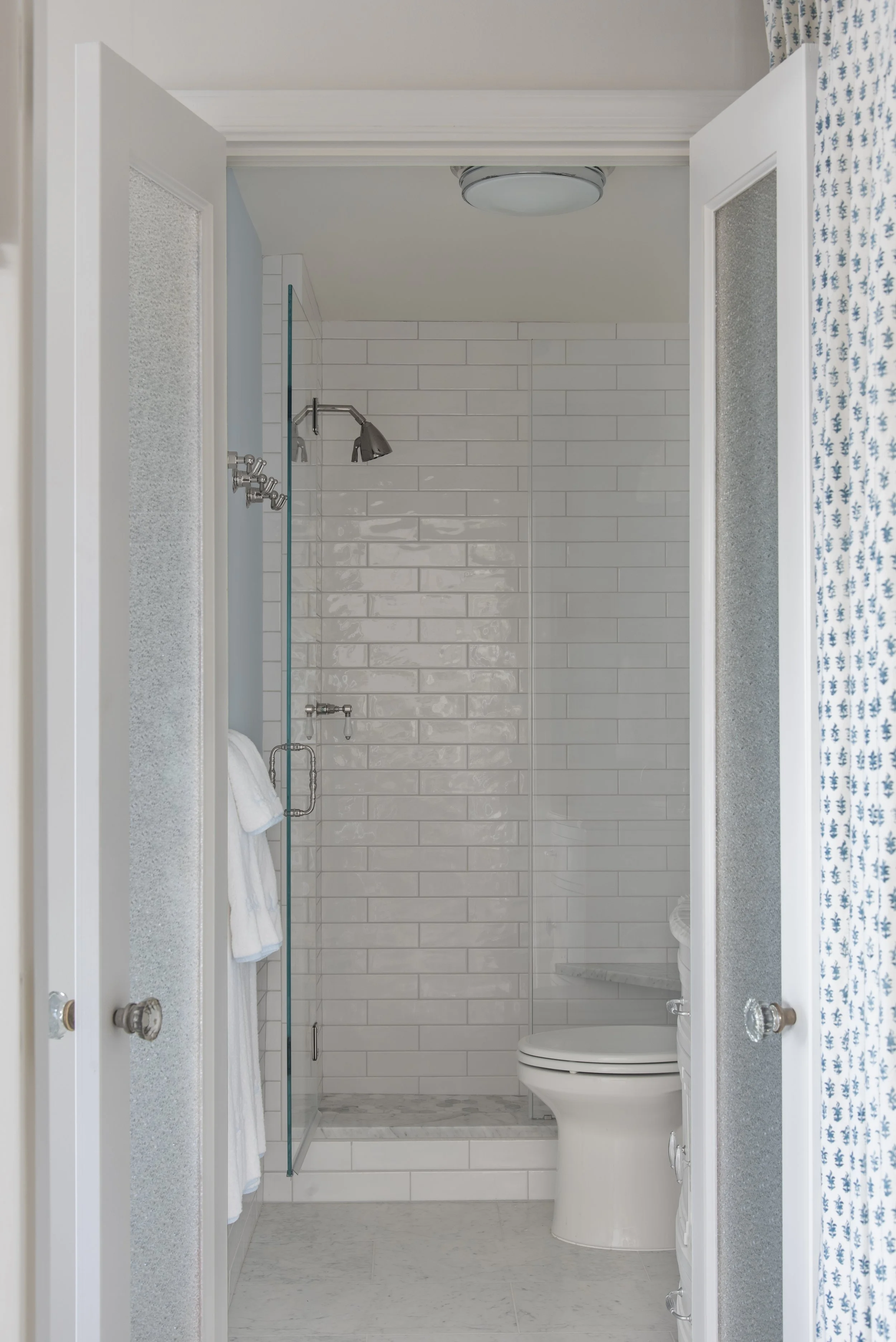 Entrance to restroom with walk in shower.