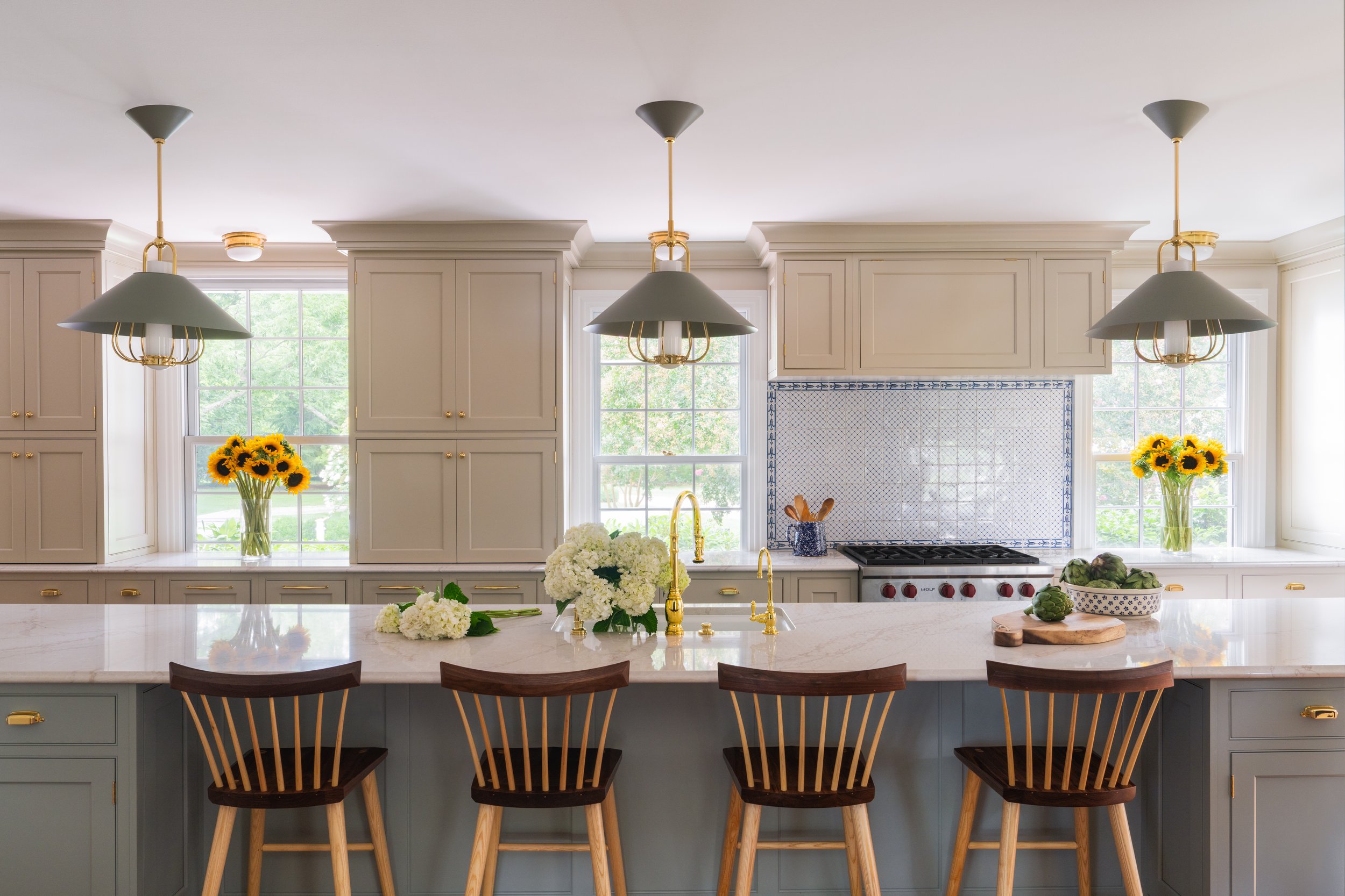 Brightly-lit kitchen with island.