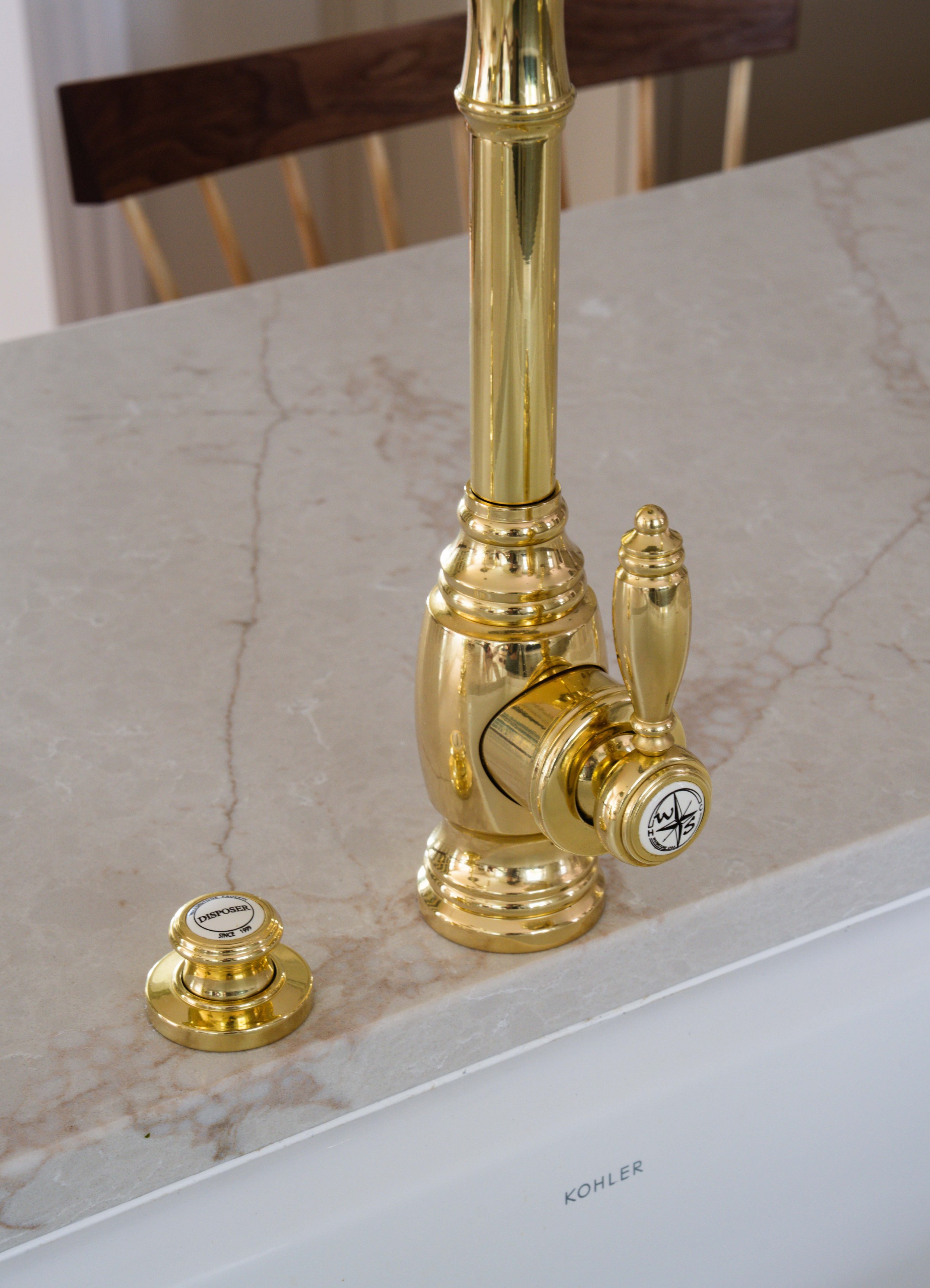 Close-up of brass sink faucet.
