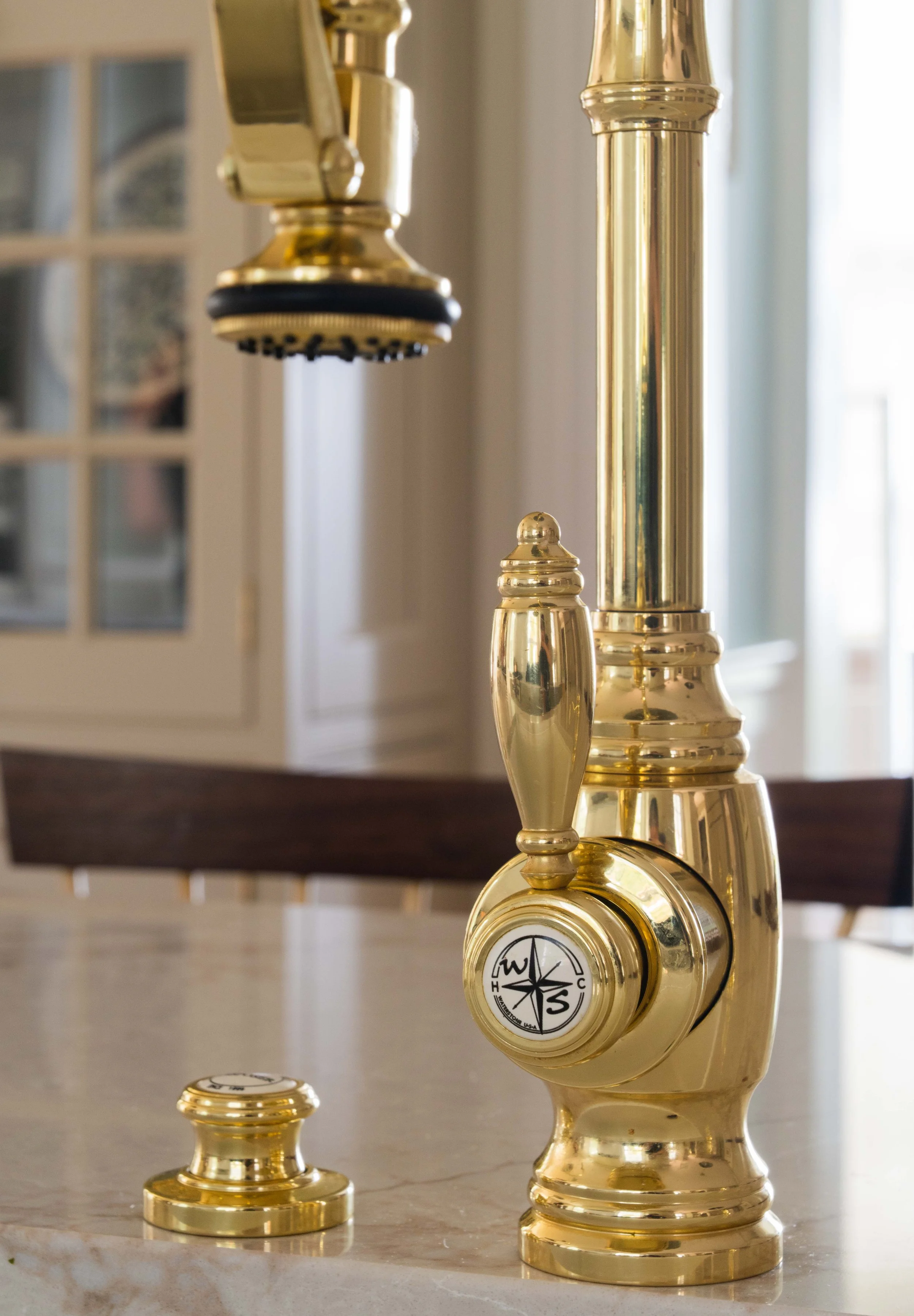 Close-up of brass sink faucet.