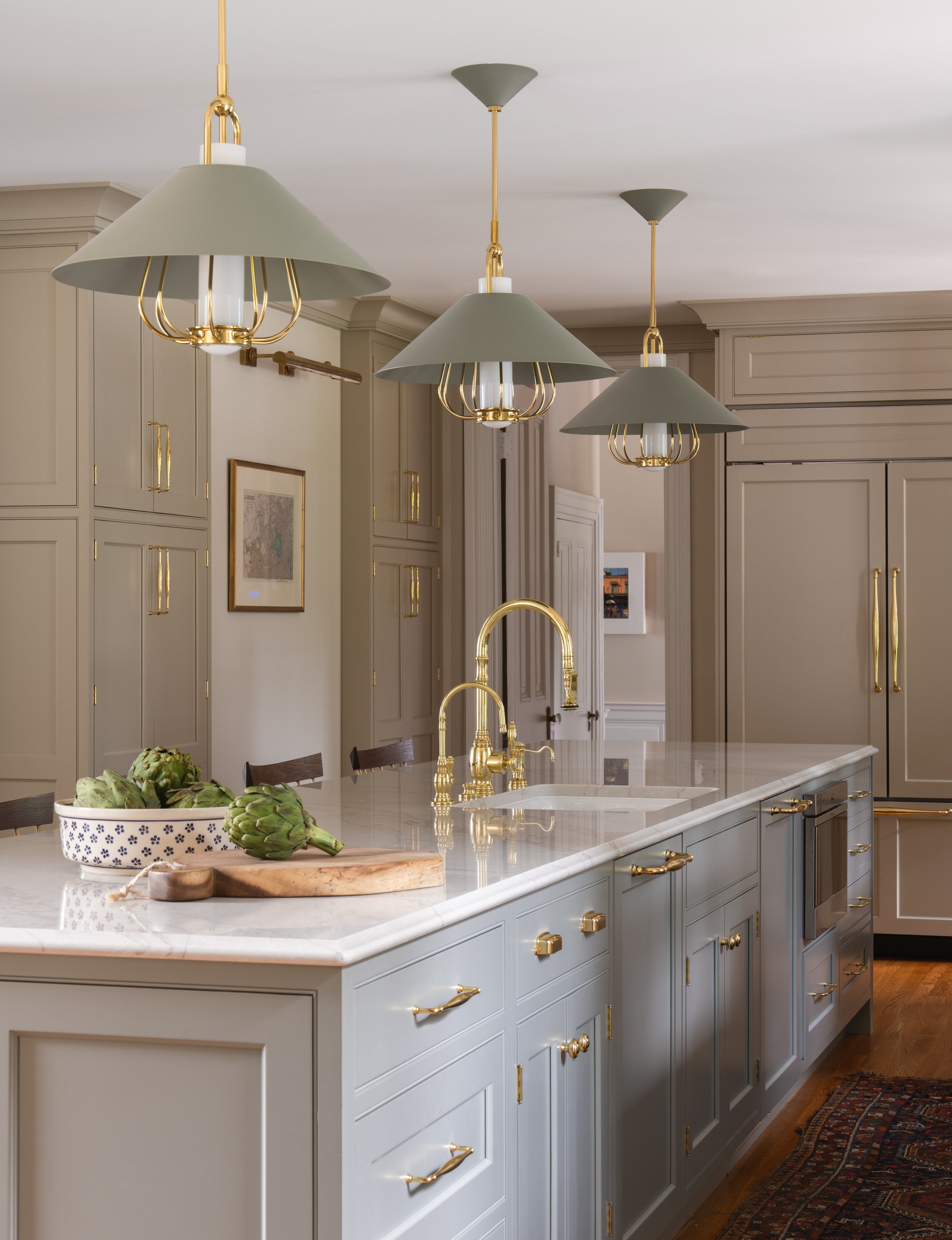Kitchen island and three light fixtures.