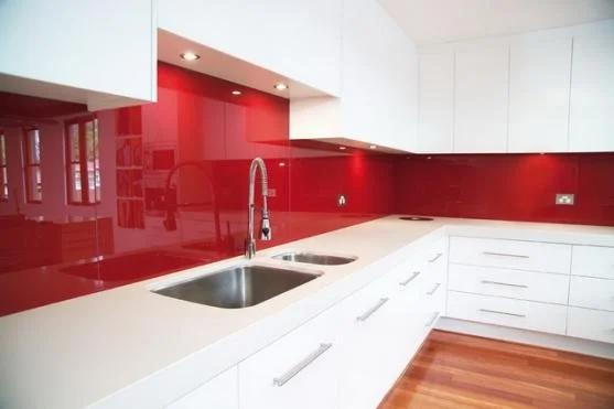 The glass splashback drove tiles into near extinction in the kitchen. Image Source - homeimprovementpages.com.au