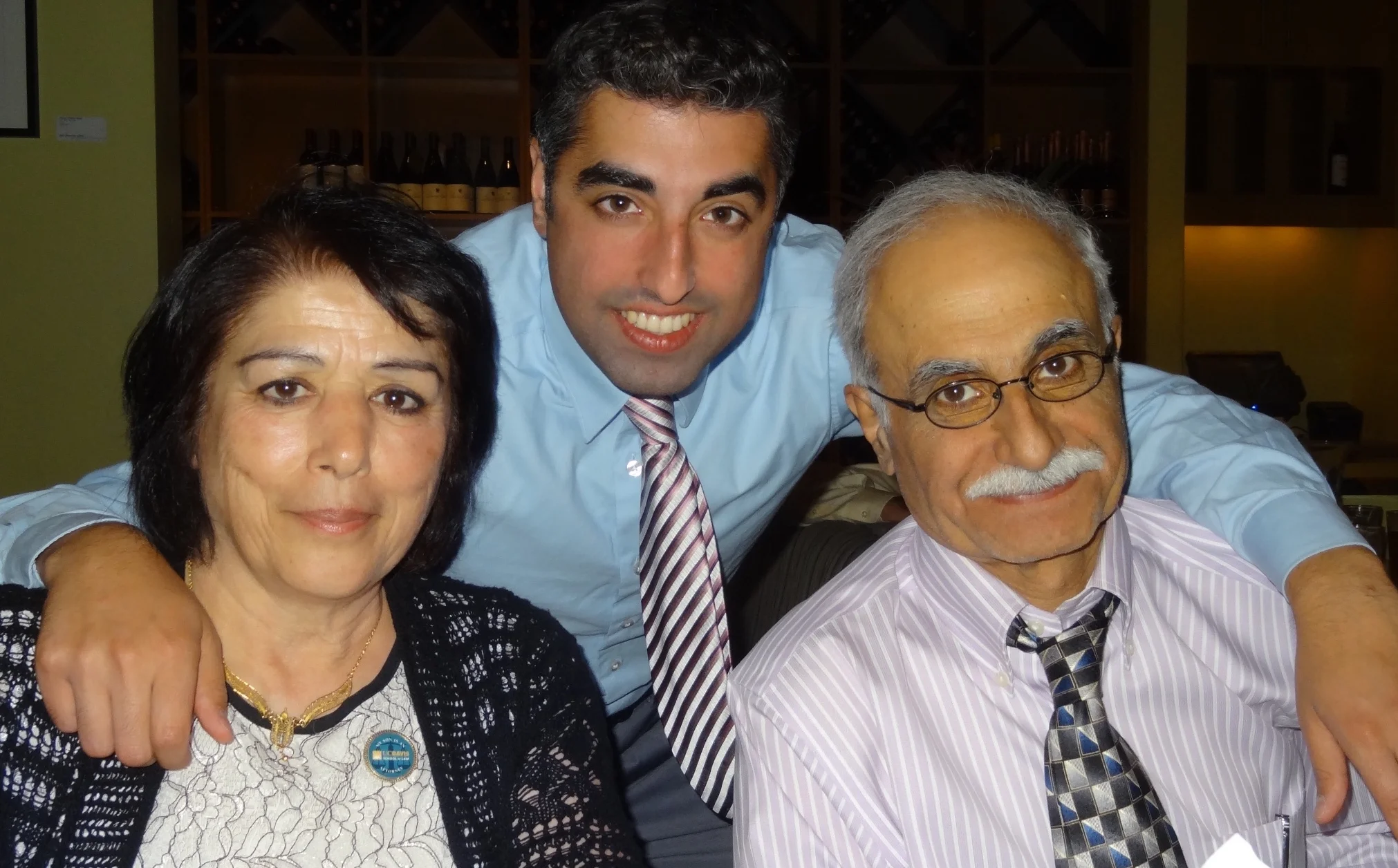 Nima Rahimi with his mother Nayer and father Mehdi. Rahimi’s parents immigrated to the United States from Iran in the 1970s. Photo by Kaveh Nikpour.