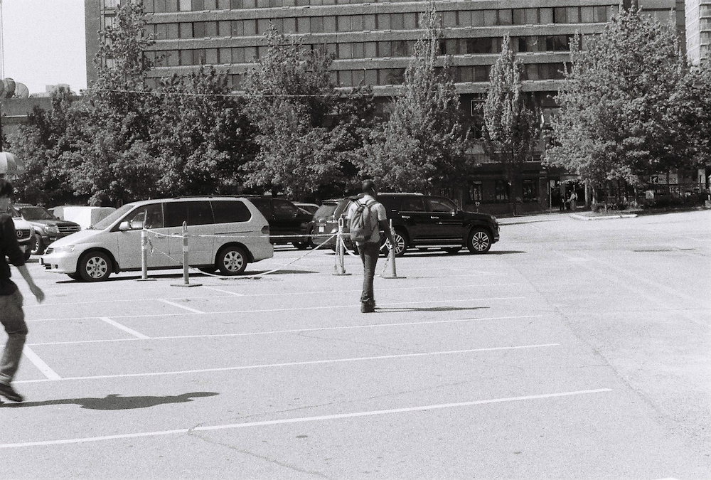 Cambie Street Grounds / Larwill Park, pedestrians shortcutting through the private parking lot.
