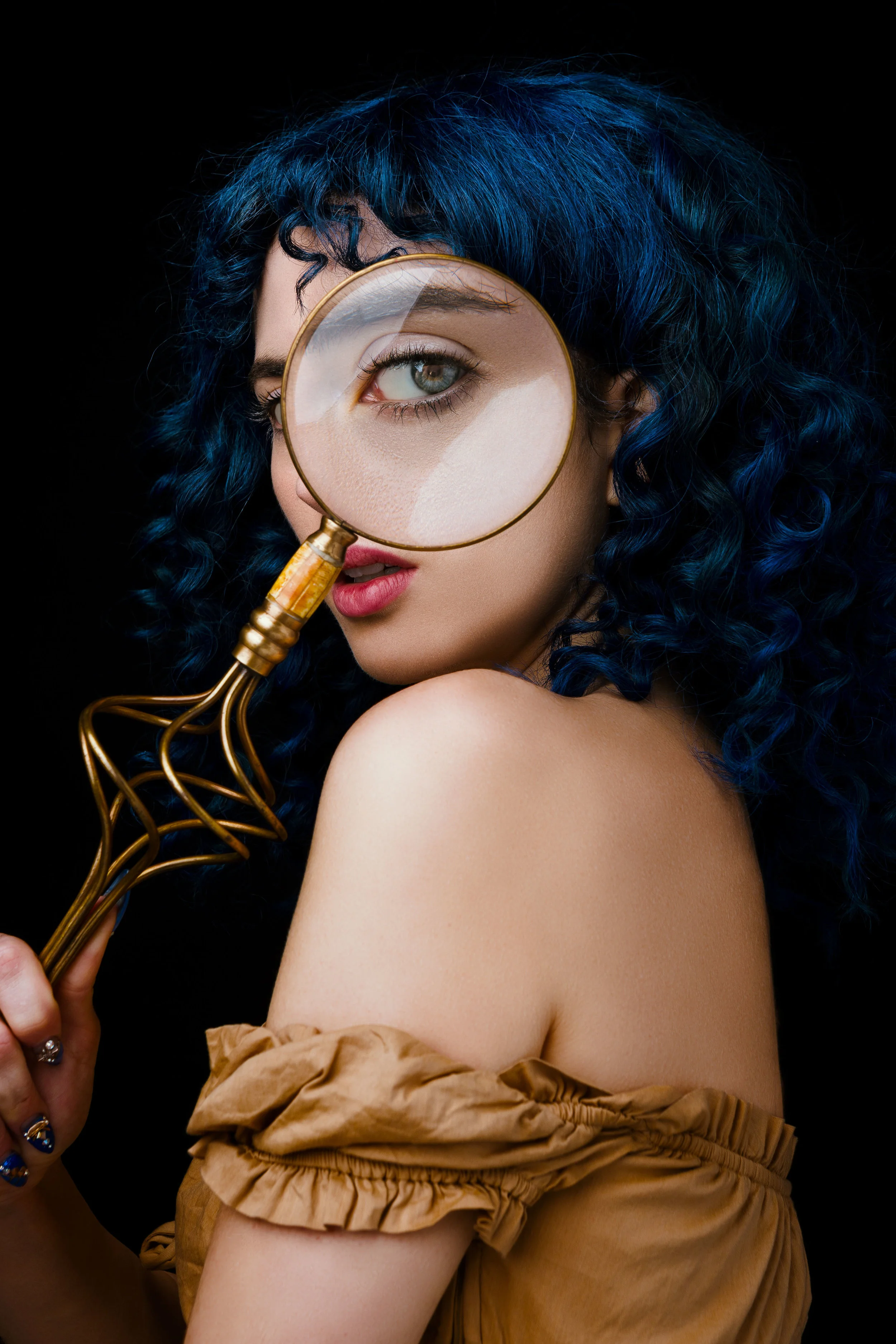 Woman with Magnifying glass Studio portrait fashion photographer Los Angeles