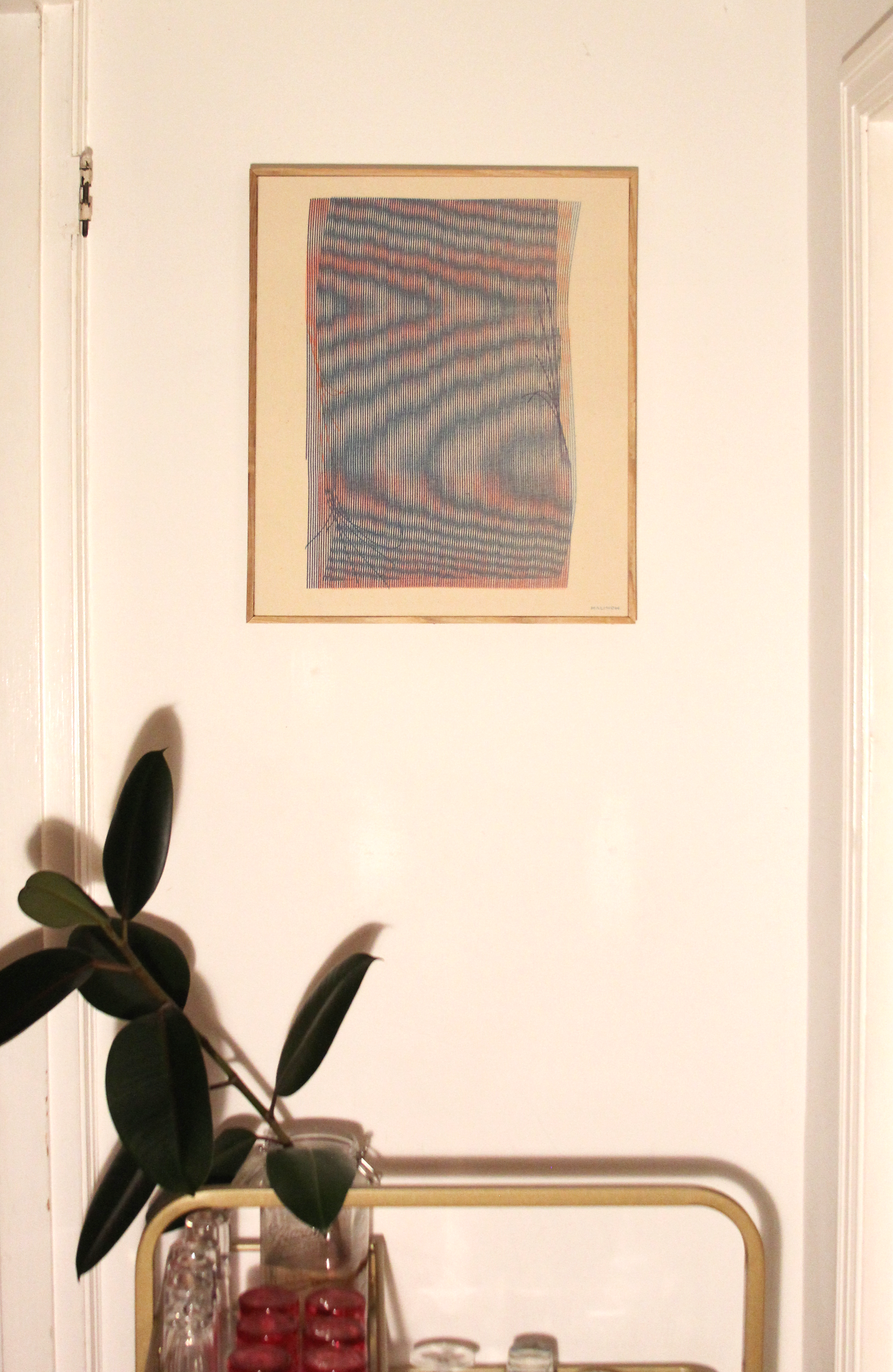 Moire plotter painting by Chet Malinow. Portland home with vintage bar cart and Original painting with custom wood frame.