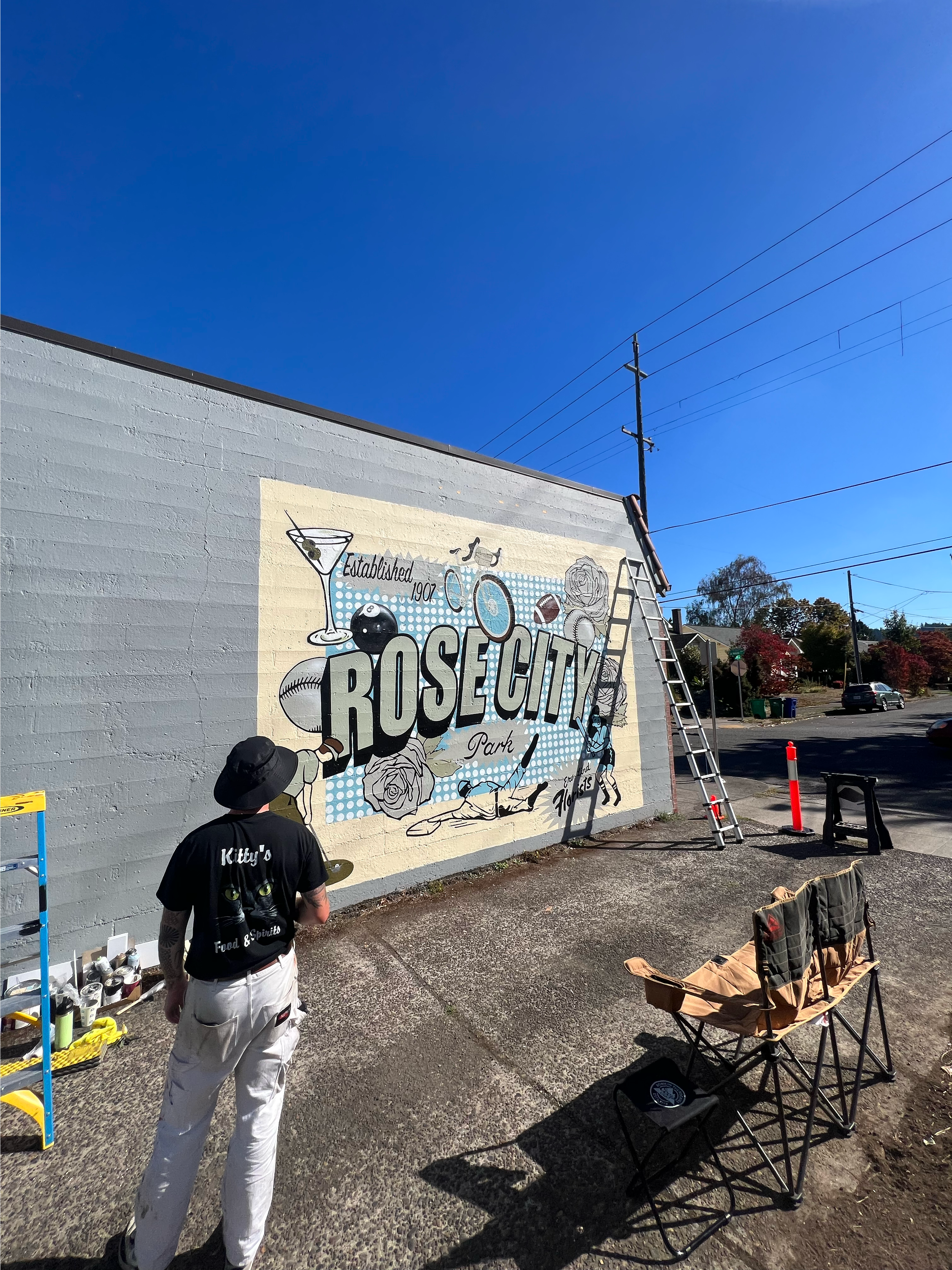 Mural designed and painted by local Portland artist Chet Malinow. Rose City Park neighborhood mural in Portland, Oregon. Biking, football, baseball, softball, golf.