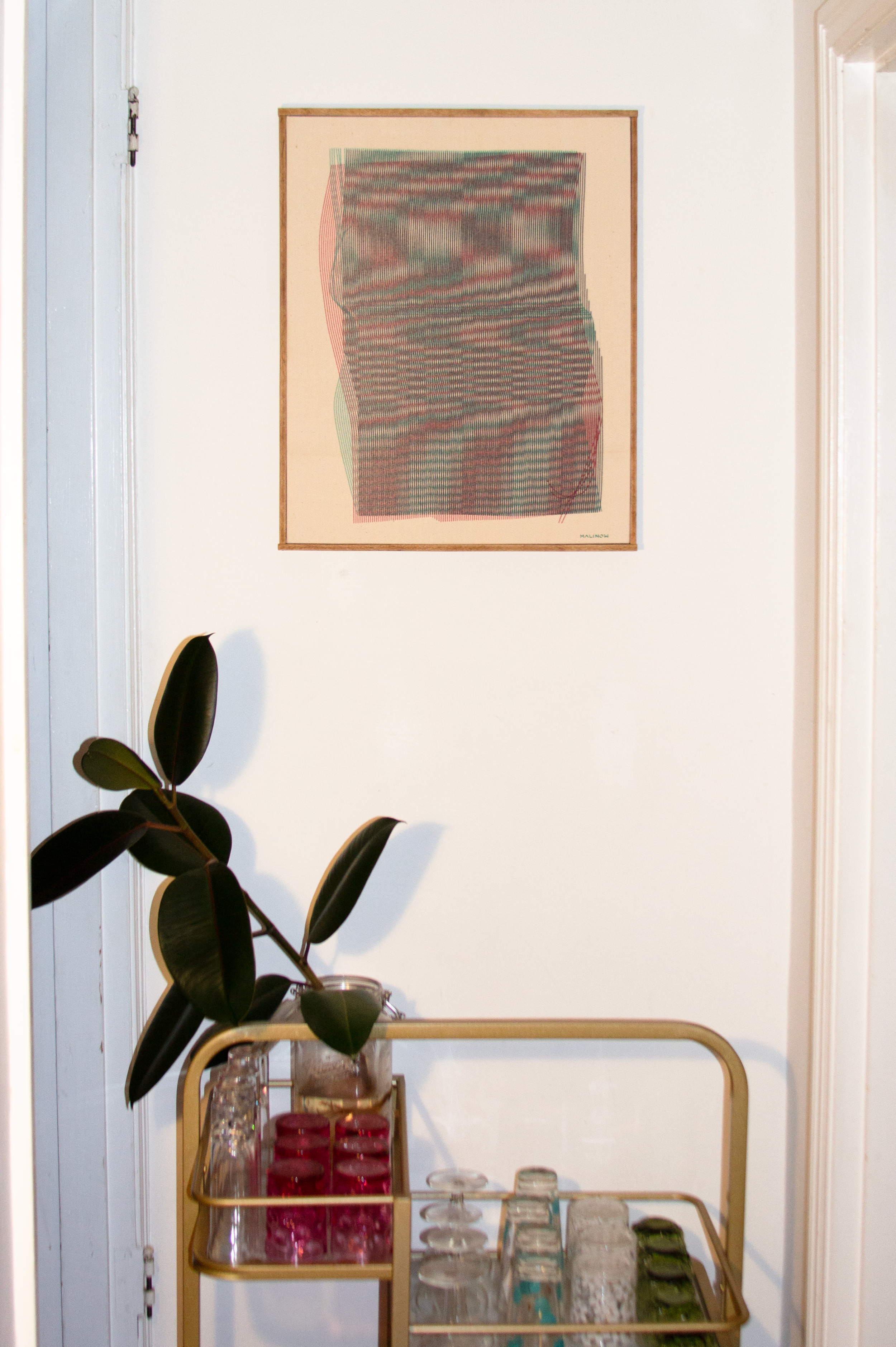 Moire plotter painting by Chet Malinow on vintage canvas with custom wood frame. Portland home with bar cart and original painting.