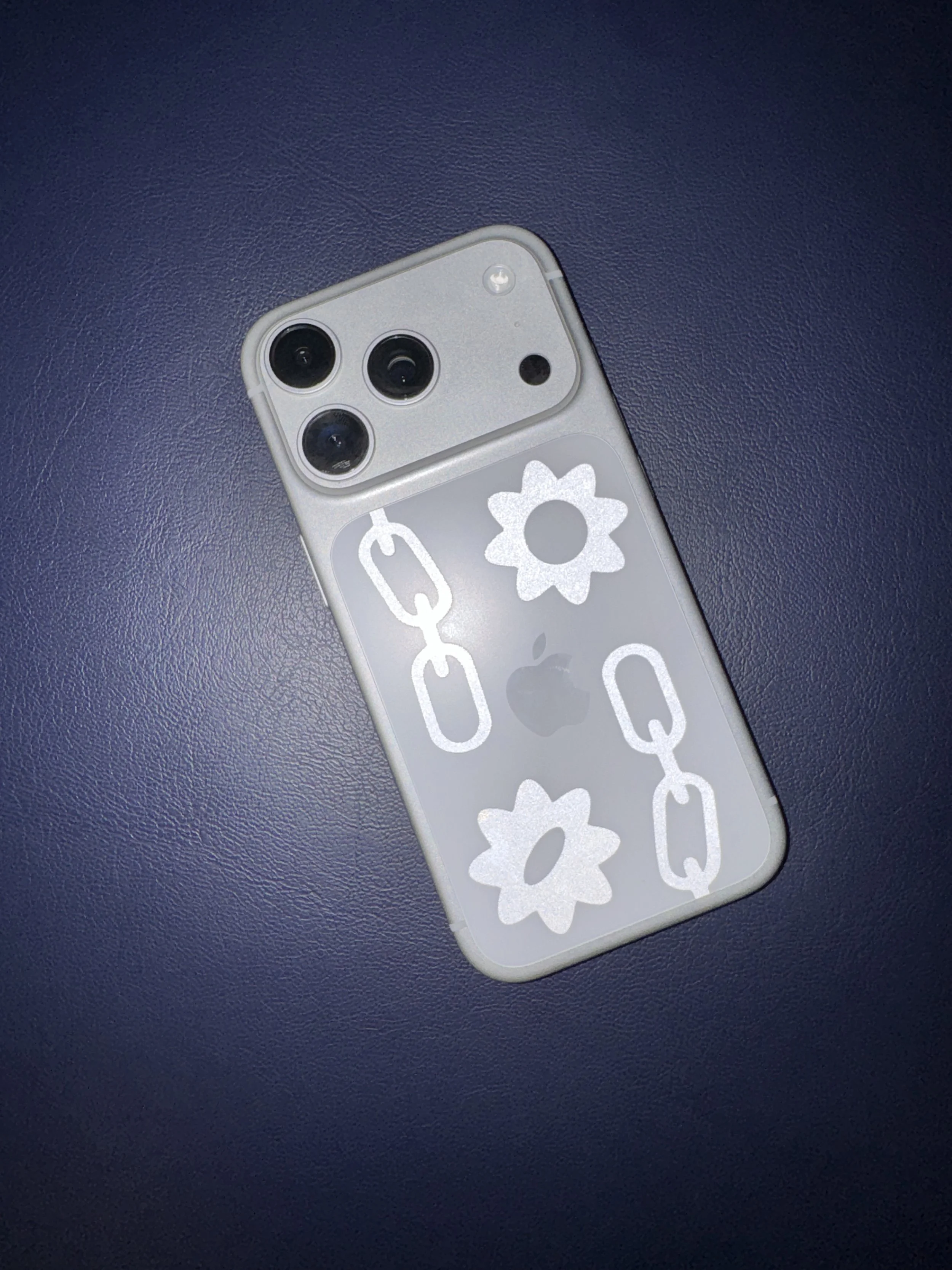 Reflective silver vinyl sticker on Iphone designed by Chet Malinow