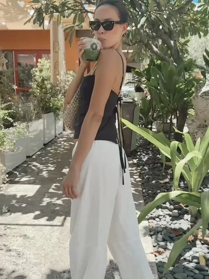 Matcha runs with Emily in the Leona Tank in Cotton Poplin 🖤
