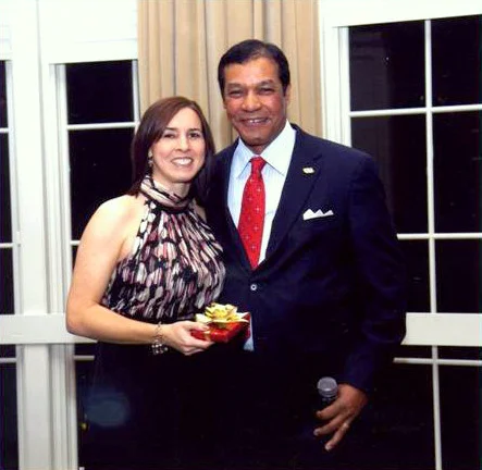 Rhaoul A. Guillaume, Sr. awards Ms. Prejean with a five year service pin during the 2011 Christmas party