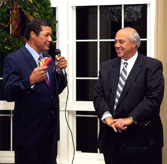 Rhaoul A. Guillaume, Sr. awards Mr. Merkl with a ten year service pin at the 2011 Christmas party