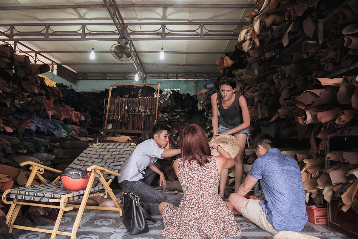 Sourcing leather scraps from a local workshop with Bella (Ha) and Laura. Photography by Ody.