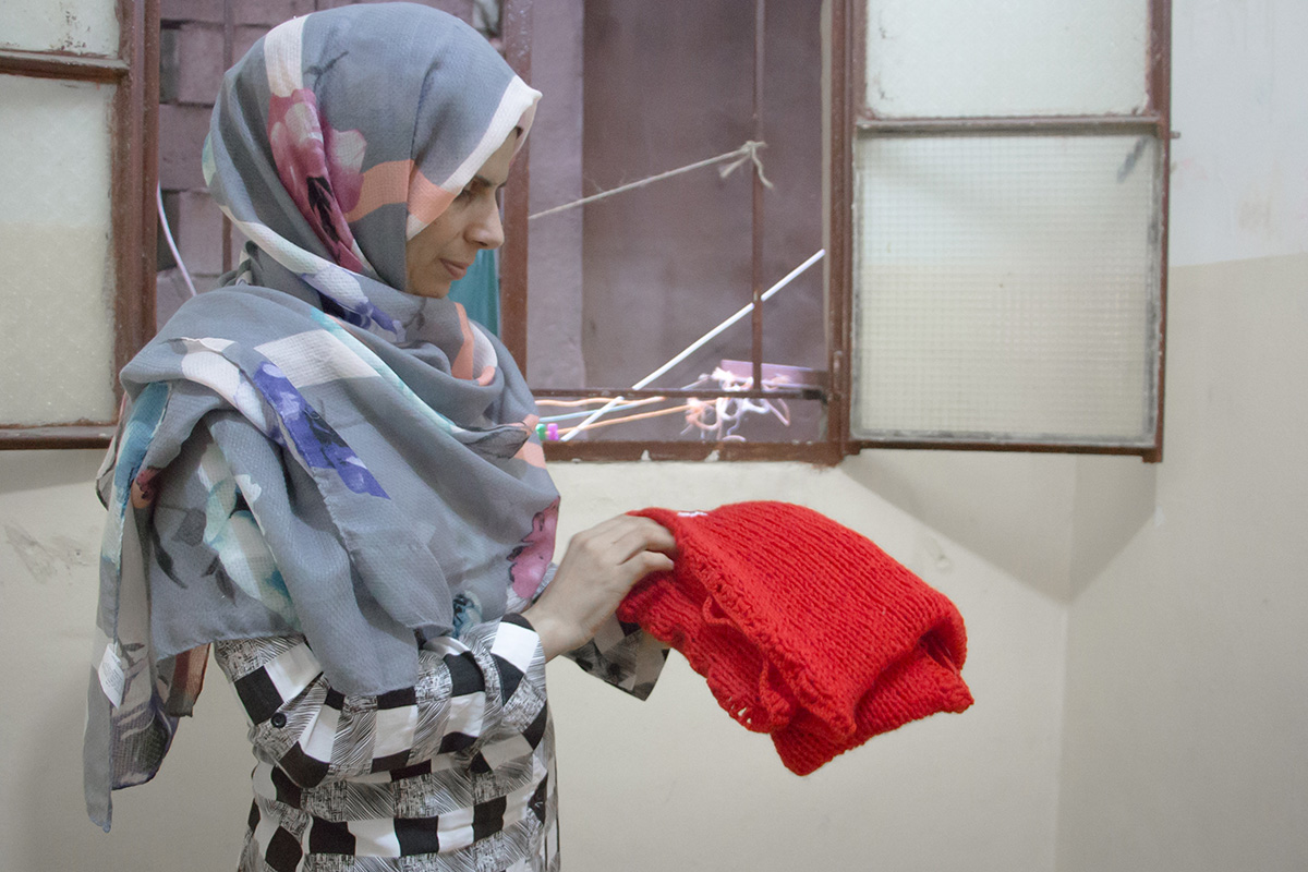 Malak holding one of the first Syrian Scarves. Photography by yours truly.