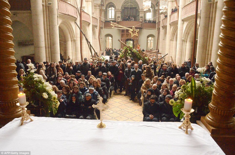 Syrian families attending Mass in Aleppo. Photo: The Daily Mail.