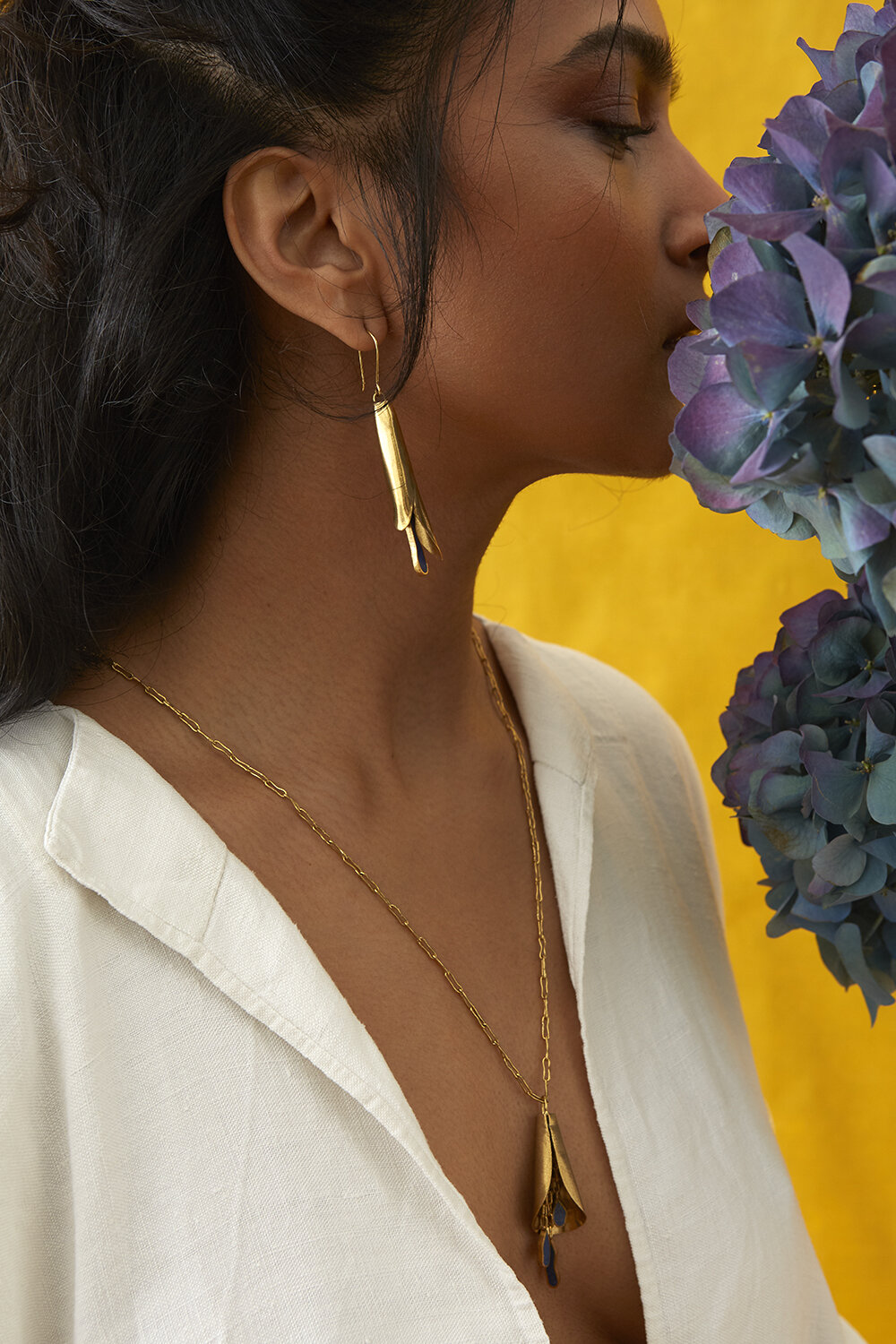 Our latest collection,  Seasons of Afghanistan , designed by Saeeda , features lapis lazuli stones wrapped within a brass body.