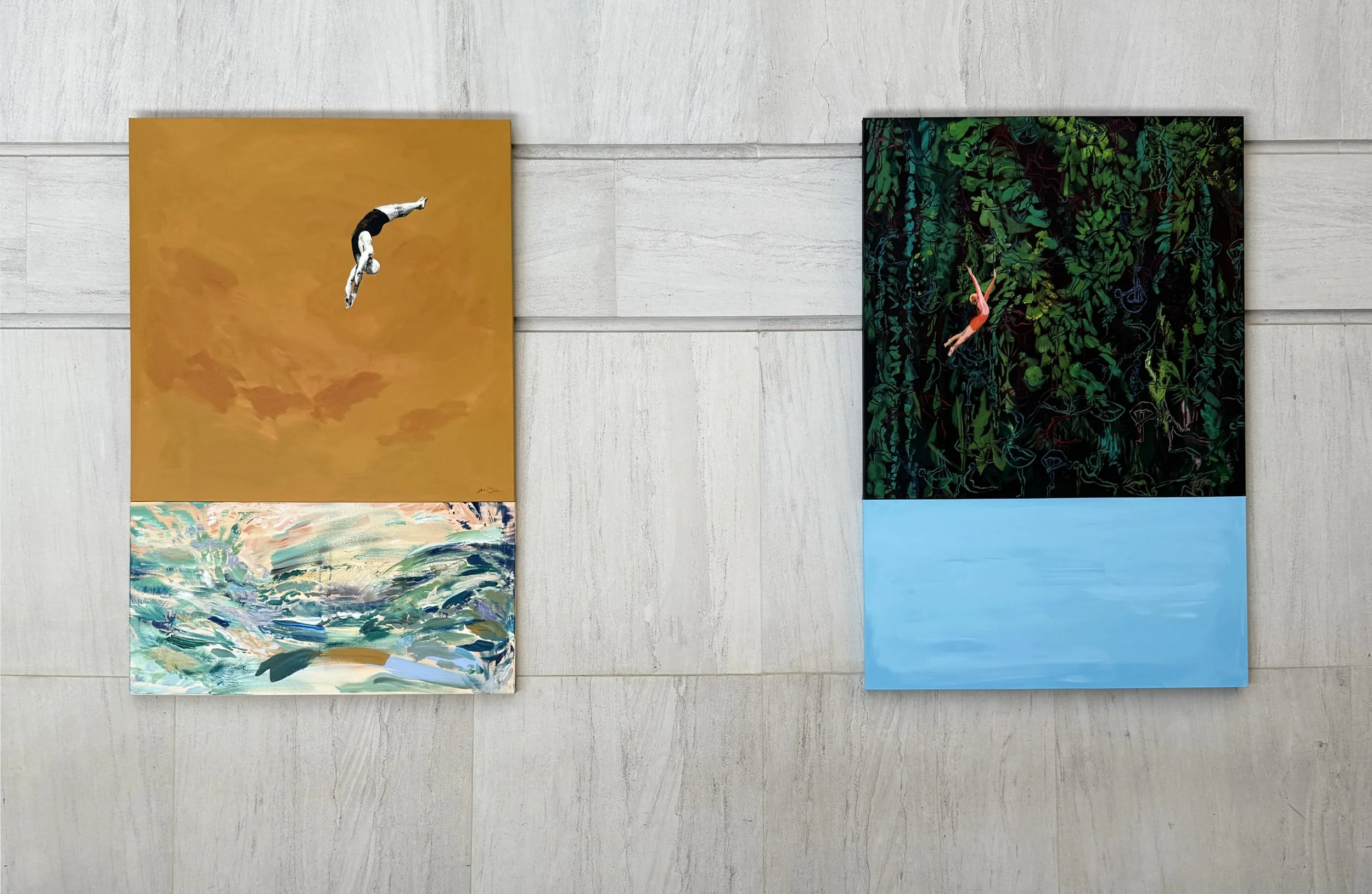 Two paintings on a light-colored wall. The left painting features a diver falling through an orange sky with clouds and a body of water below. The right painting shows a diver diving into a blue water scene surrounded by dark green and black foliage.
