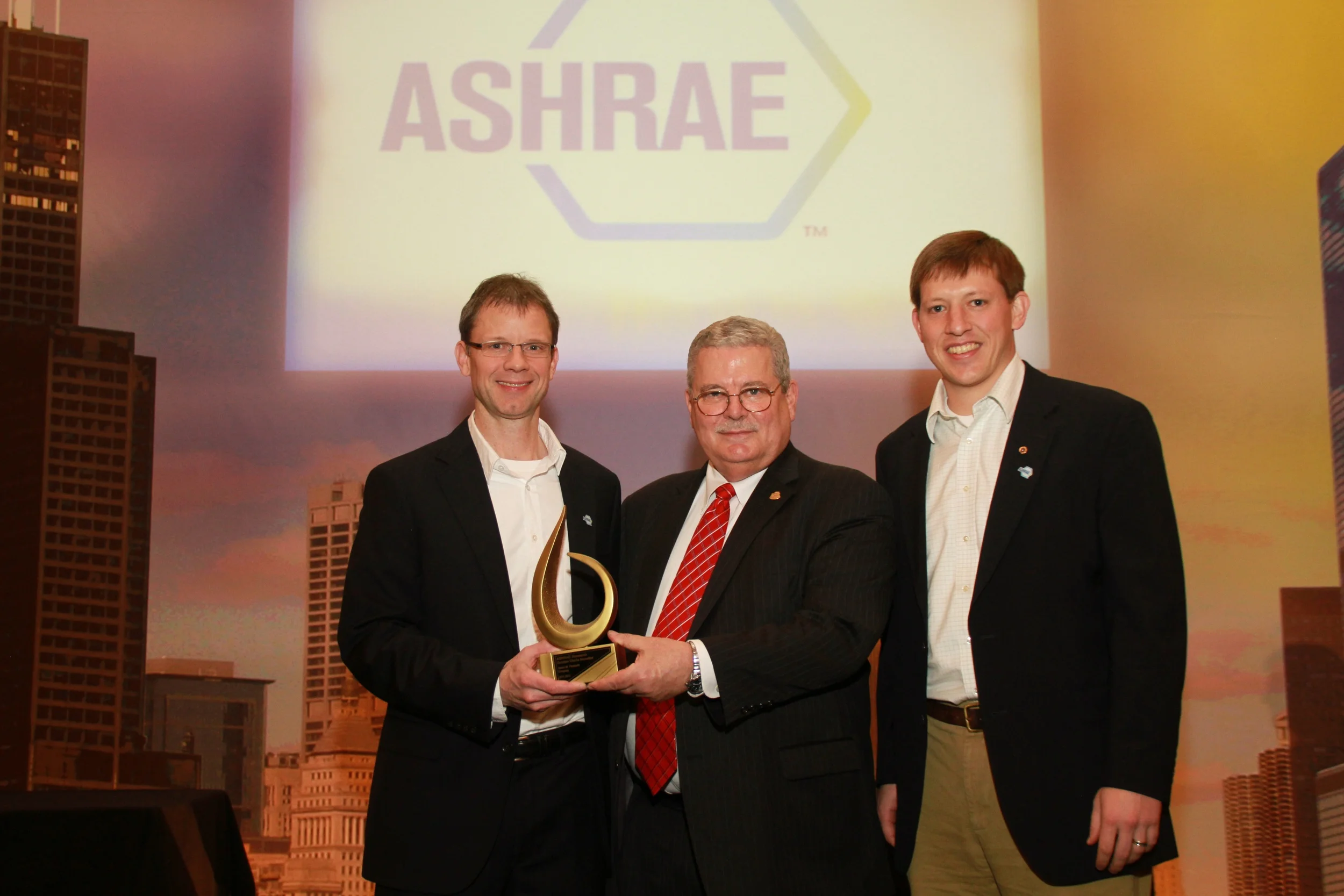 JMP employees accept Gold Circle Award from ASHRAE Research Foundation
