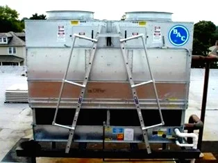 Inclined ladder on single story counterflow cooling tower.