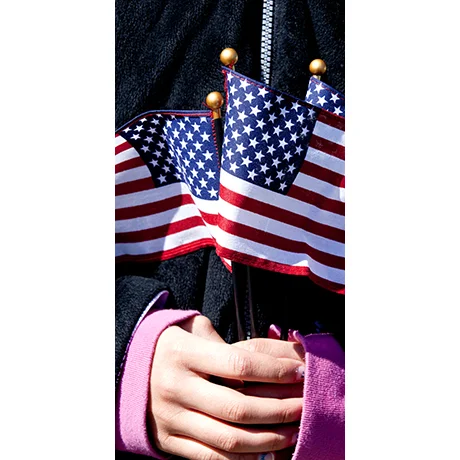 A Child holding American Flags