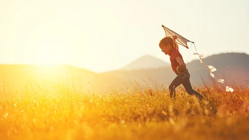 Running with a Kite Through the Meadow