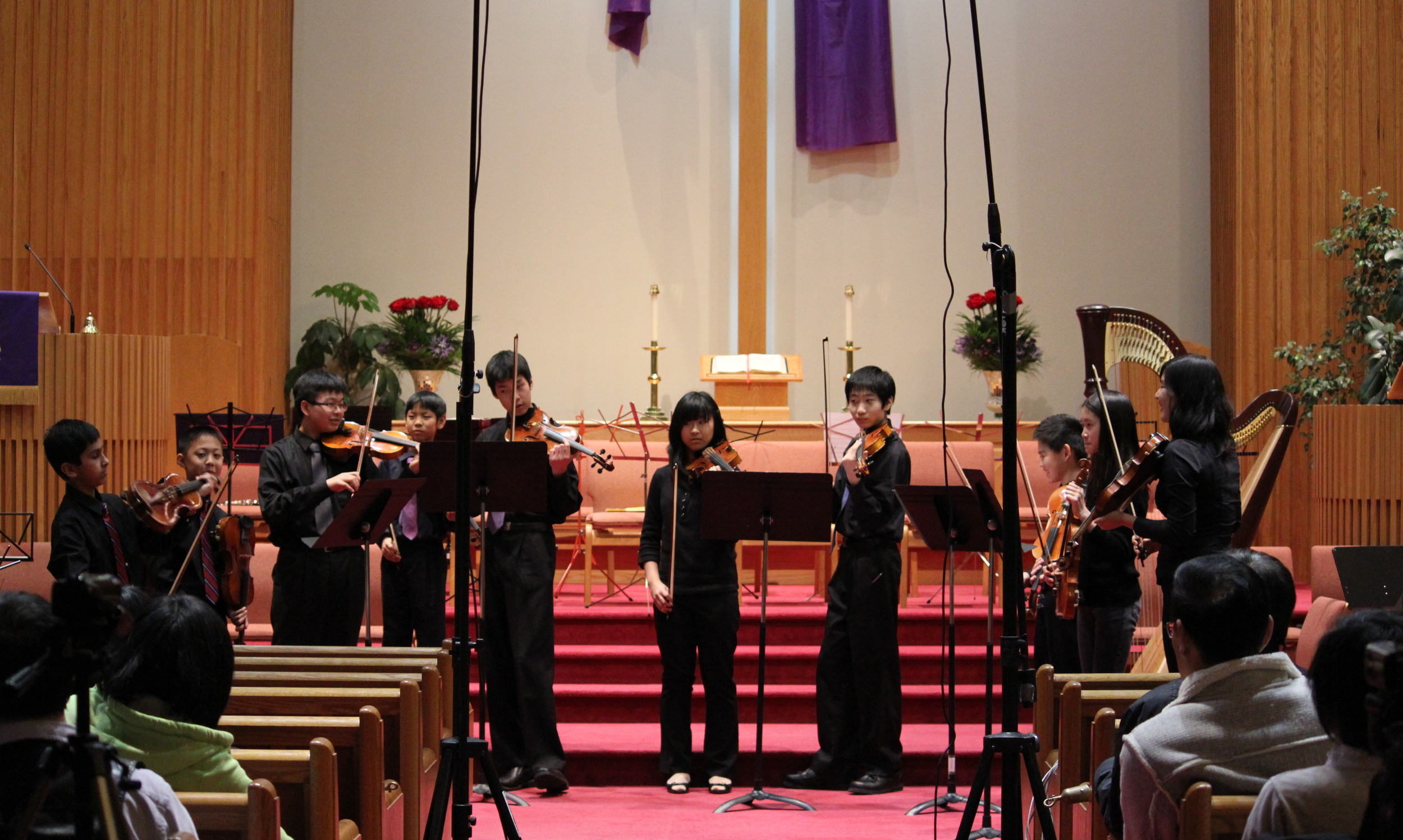 A young violin ensemble performs Telemann