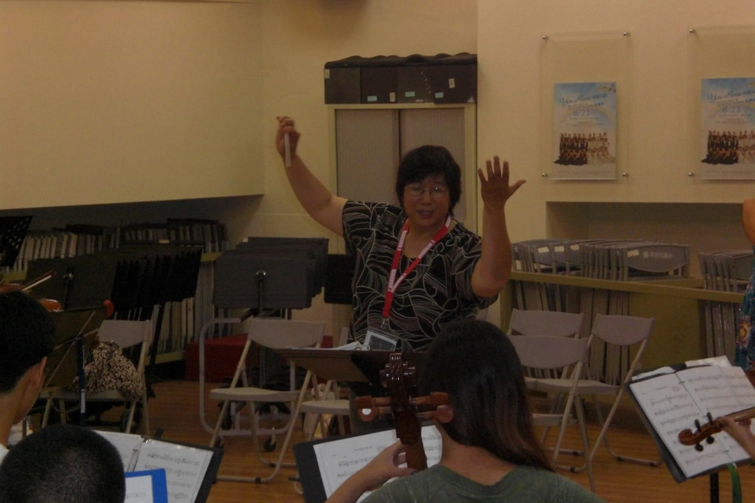 Ms. Lin conducting rehearsal