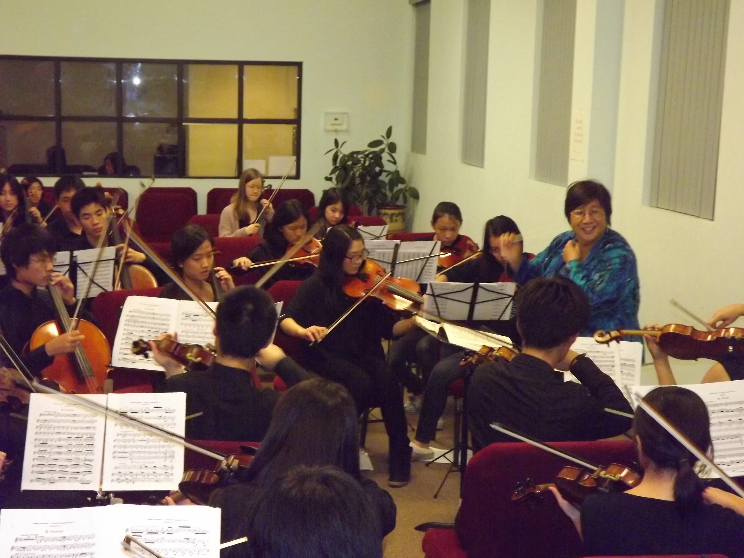 Sinfonia - Ms. Lin having fun with students - 2.JPG