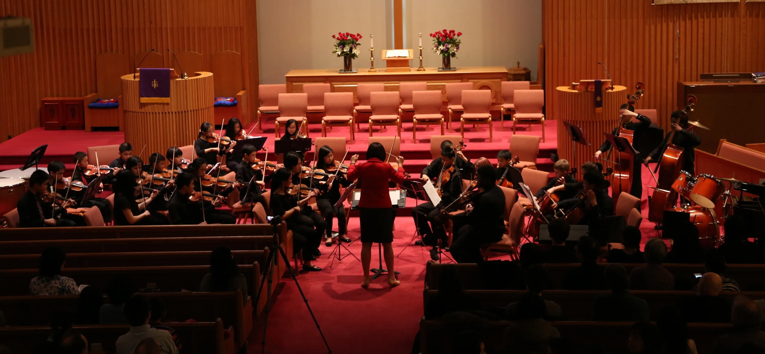 Ms. Gonsky conducting Strings Ensemble in fun pieces.JPG