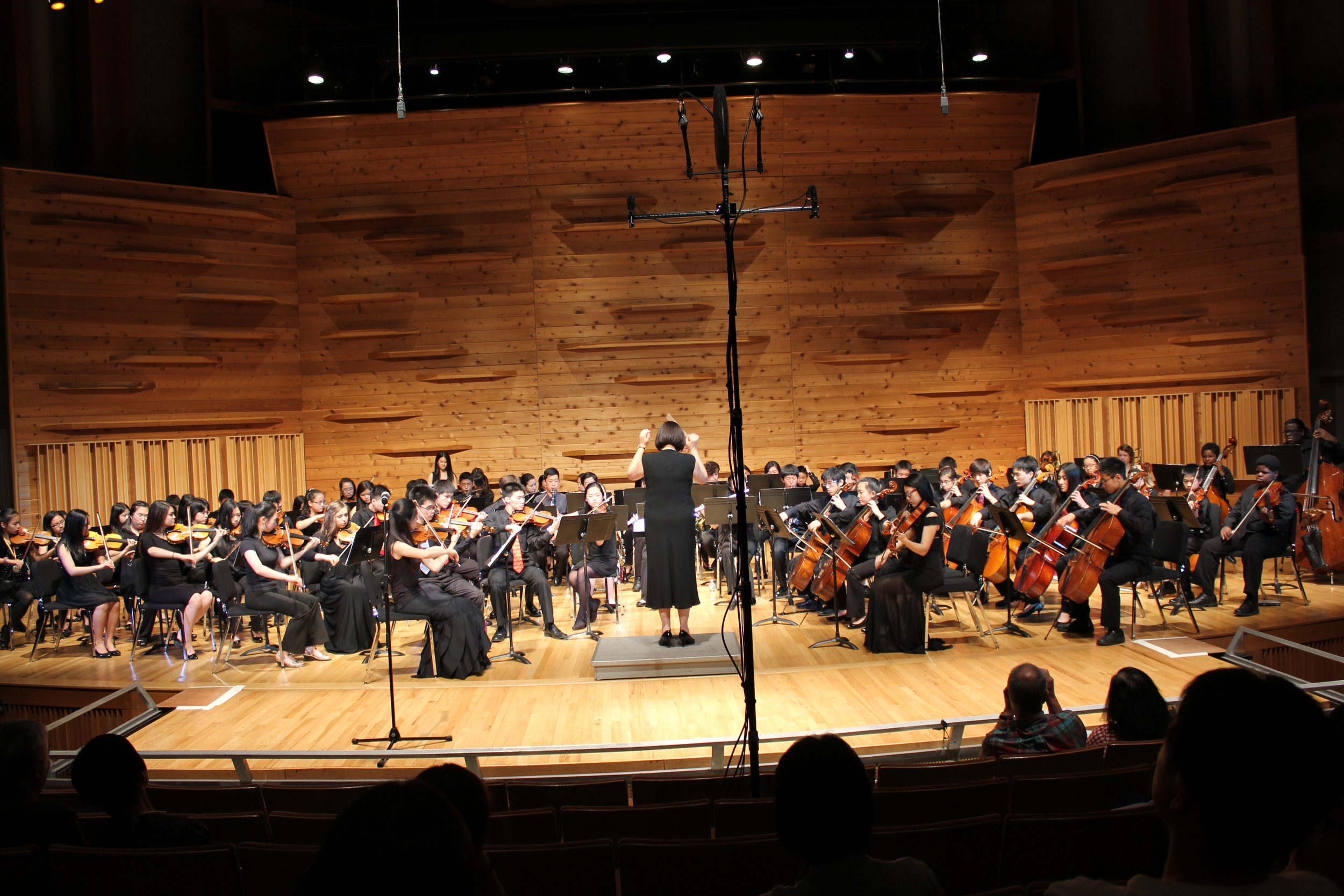 Ms. Gonsky conducting the final piece of the season