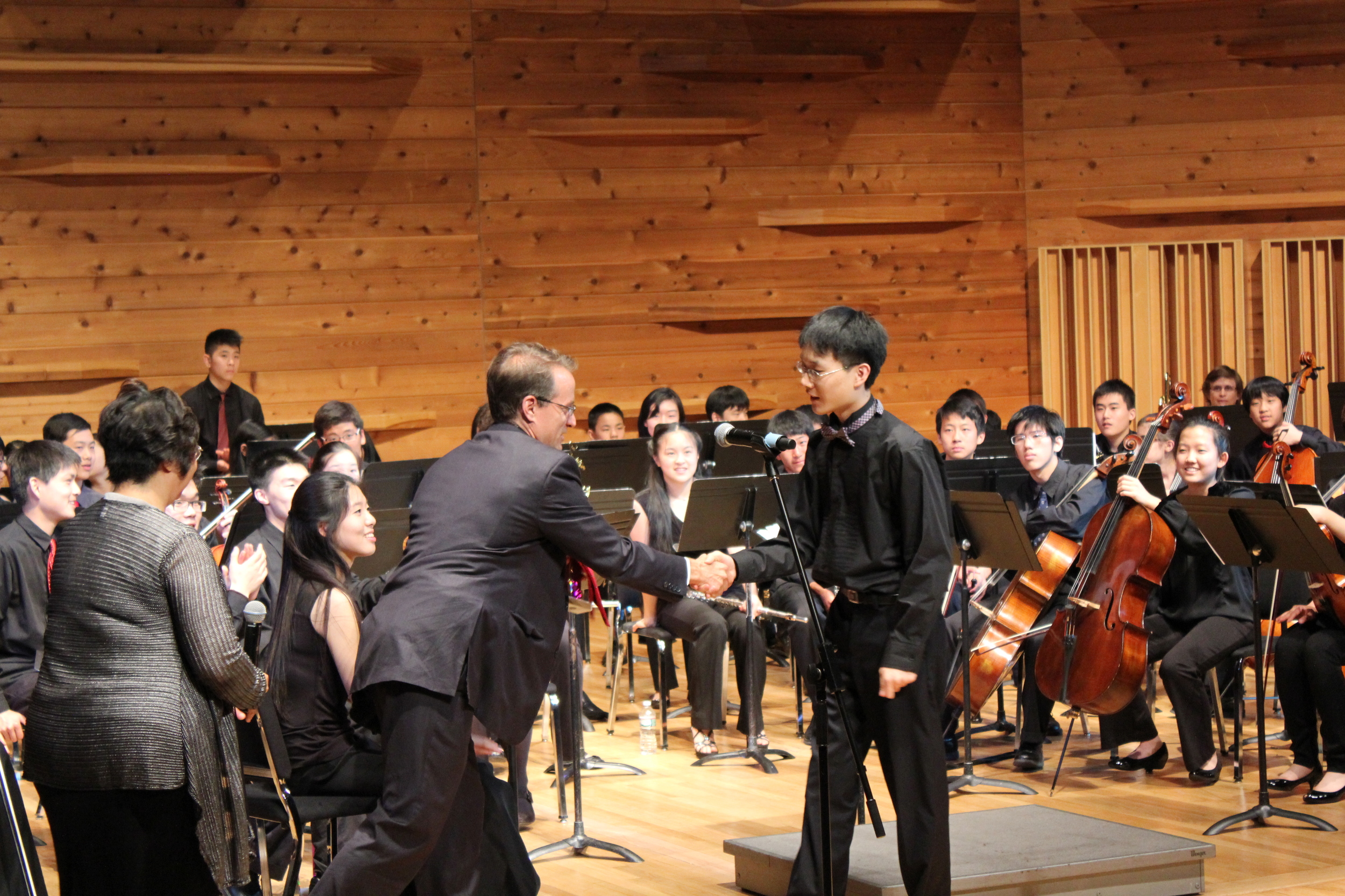 Rutgers Extension Divisi on division director, Christopher Kenniff presenting award to cellist Patrick Kim