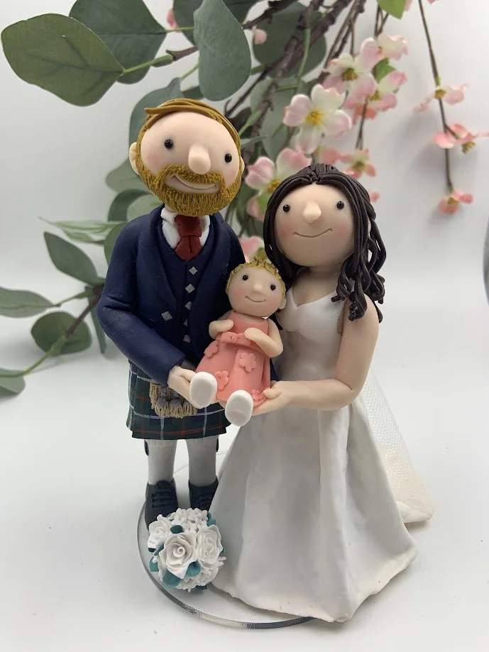 Couple with baby wedding cake topper.JPG