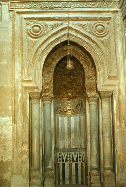 The mihrab. Notice the wood in the hood (the top part of the arch-like enclave). (Photo from archnet.org)