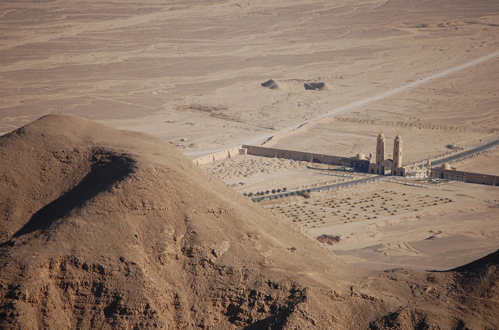 Looking down at the monastery from the cave. The two gates frame the entranceway. (Photo by author)