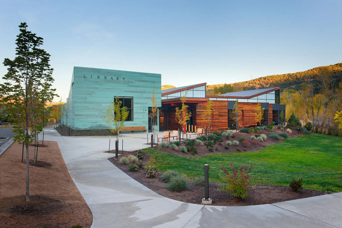 The distinctive copper community room marks the front corner of the Library