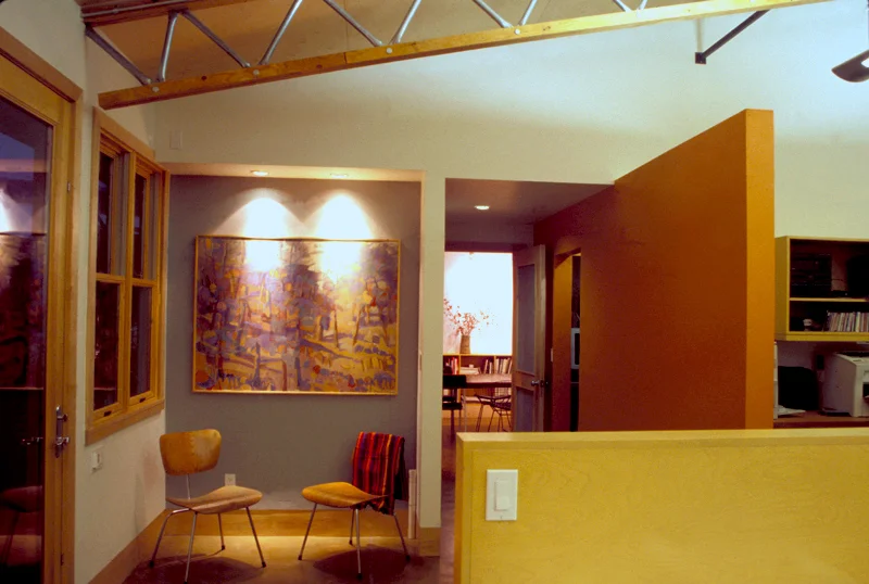 Office interior with the orange wall leading to the front conference room
