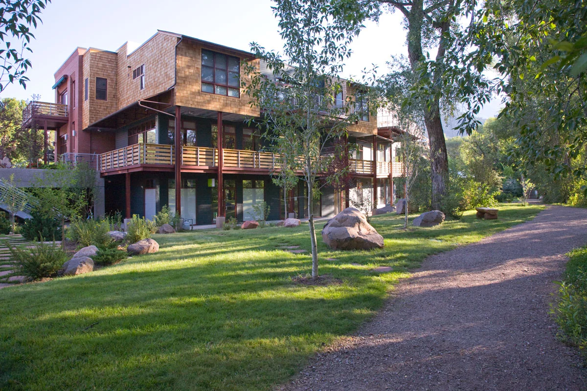 The river side of the project uses wood shingles and a more informal feel to engage with the landscape