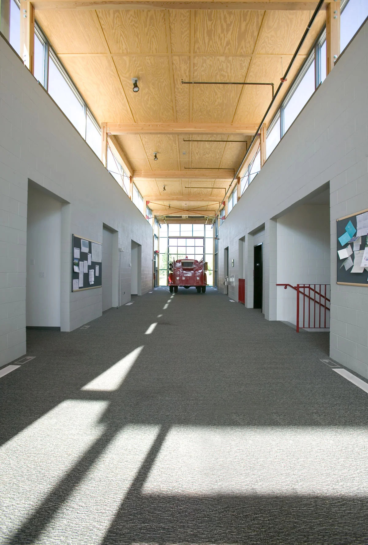 The main atrium of the C&RFPD Headquarters reflects the utilitarian sprit of the organization, but provides a welcoming space featuring the district's historic fire truck