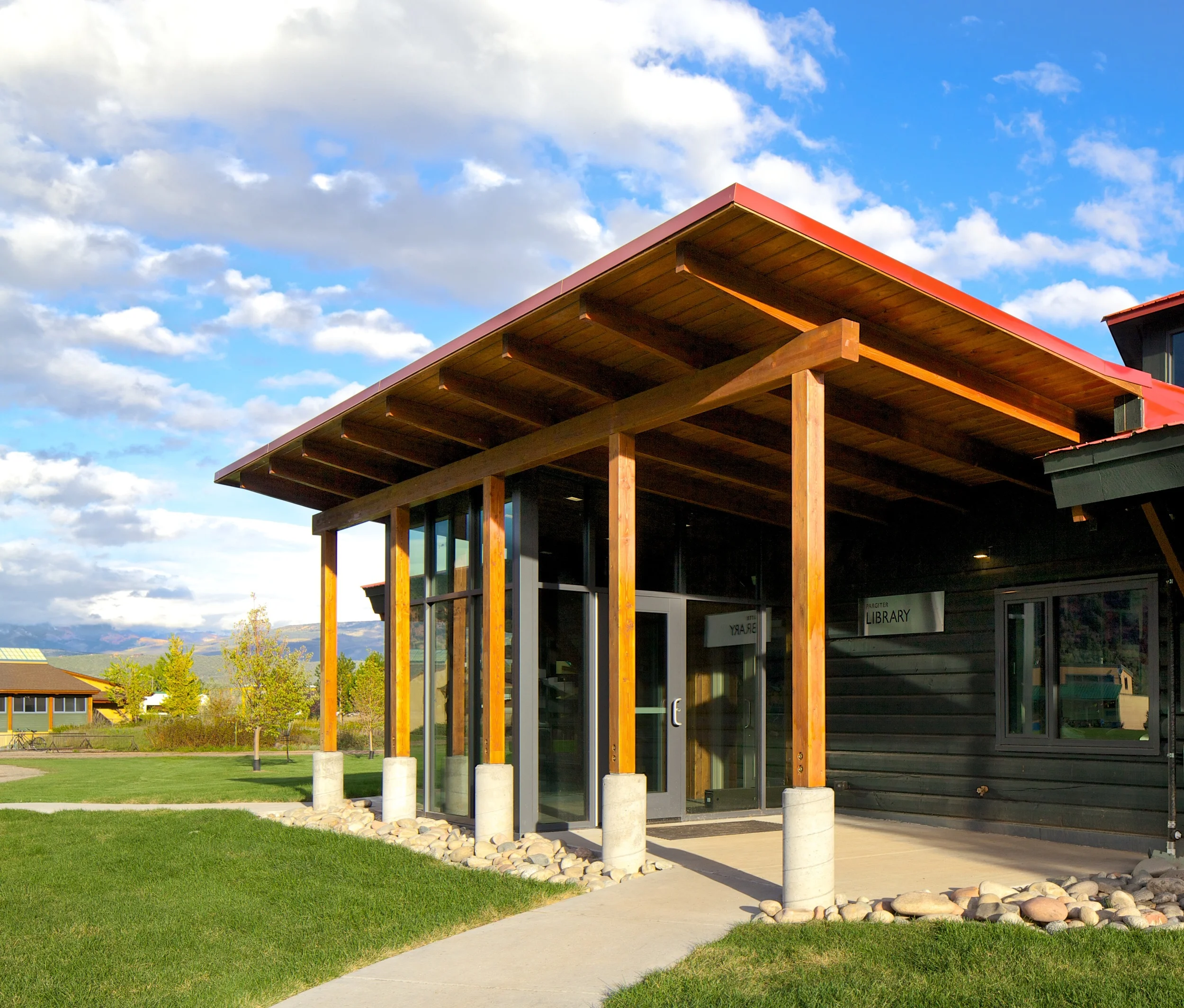 The entry was moved to the other side of the building to engage with the highly trafficked path between the main classroom building and the dining hall