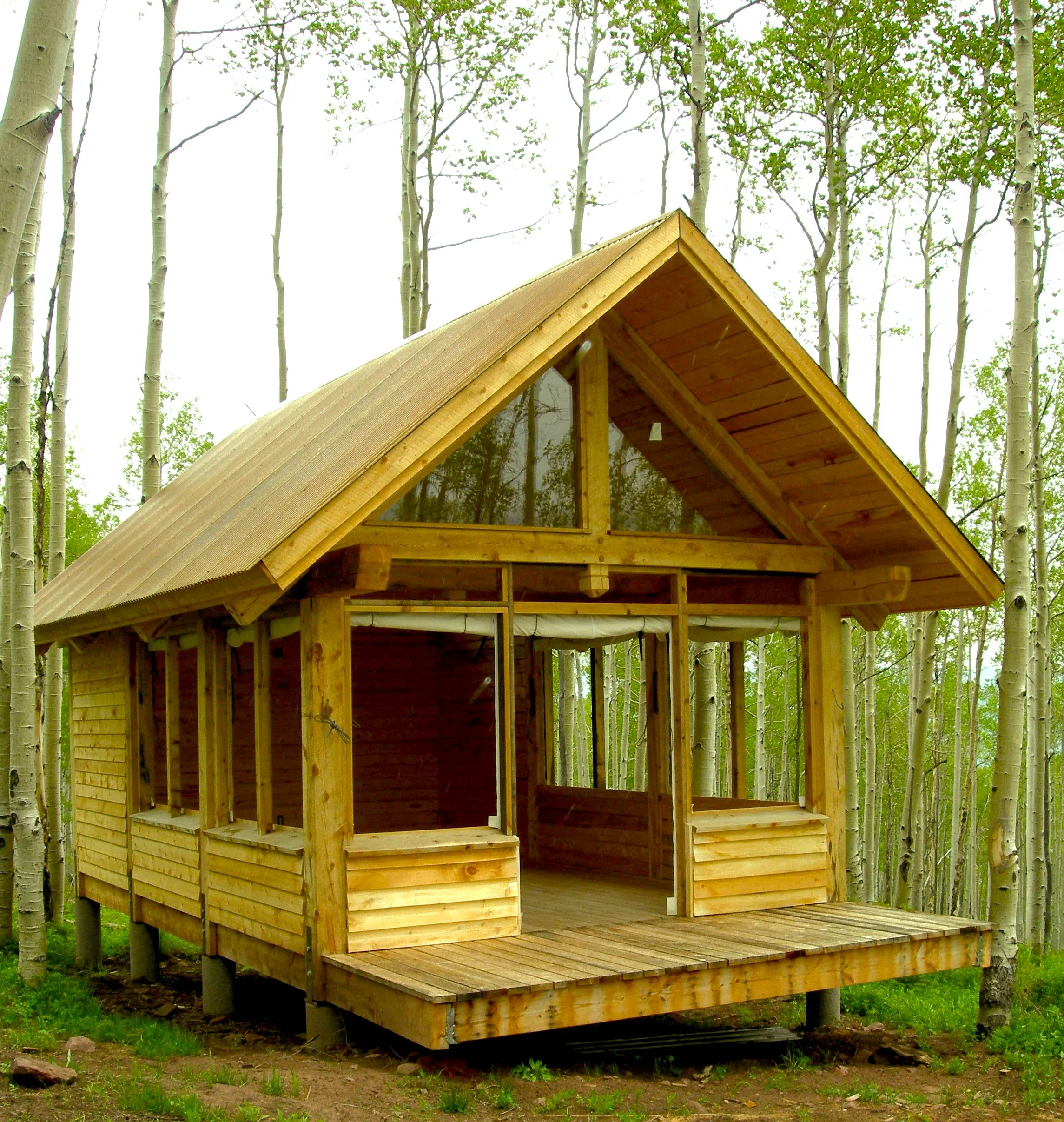 Its canvas panels open up to the surrounding aspen grove