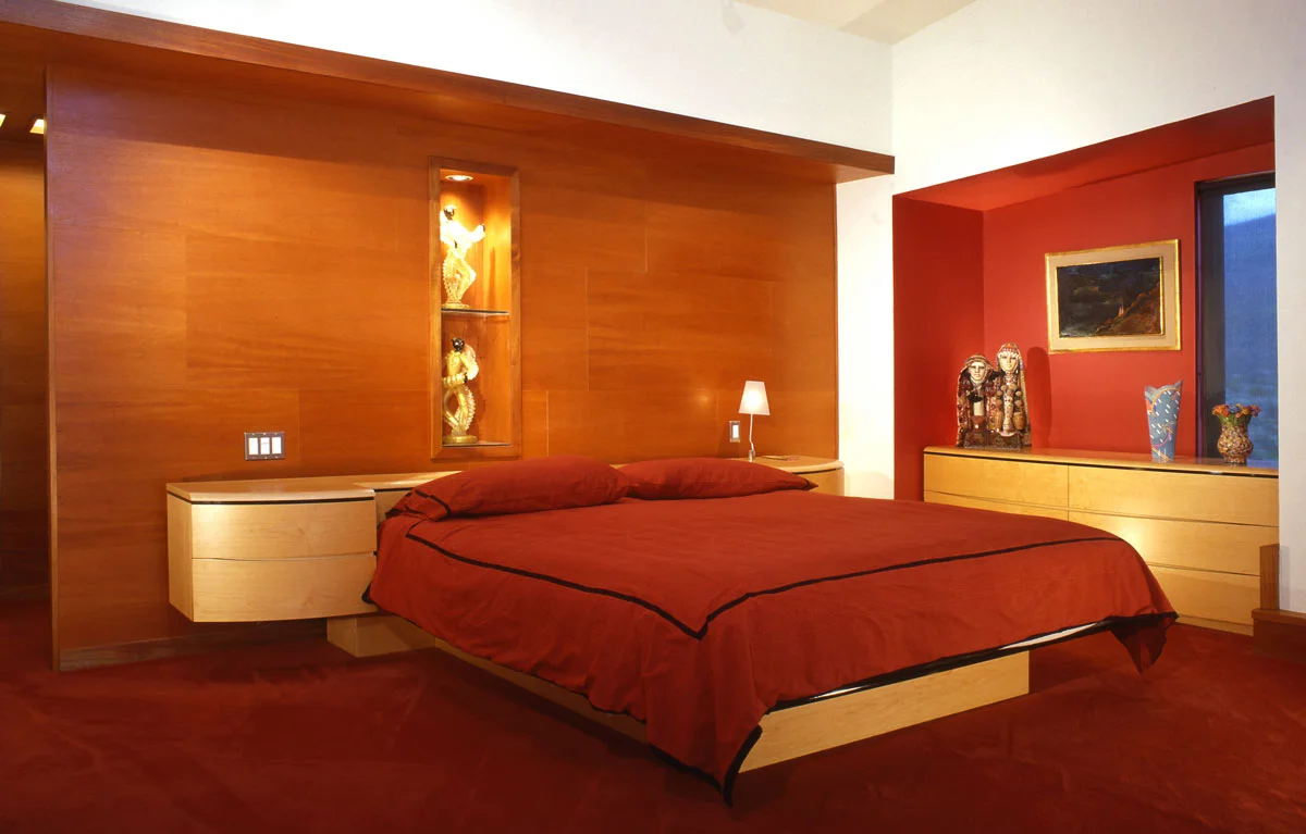 The new master bedroom combines clean modernity with warm color