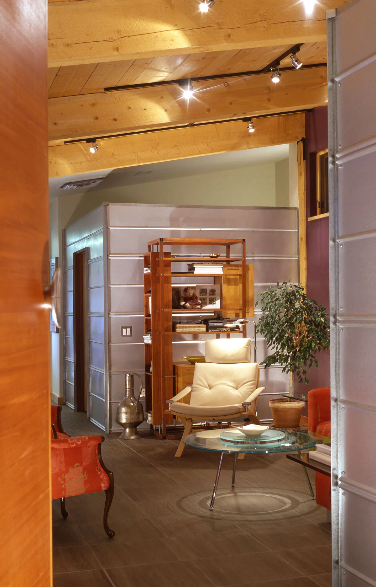 A cozy sitting room connects the wing to the rest of the house