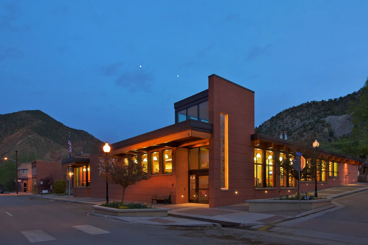 The front southwest corner engages openly with the library's downtown context