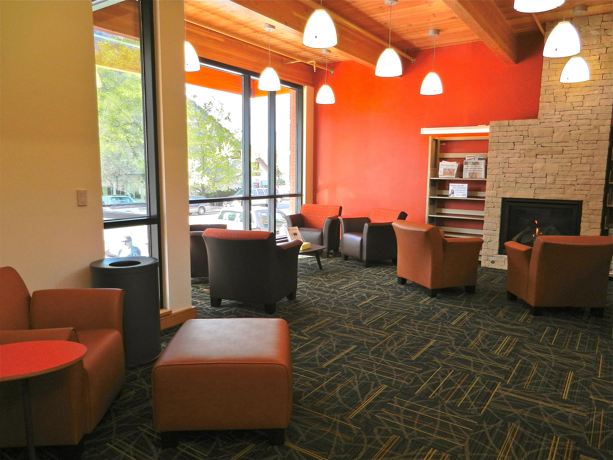 The reading room in a new addition to the west provides a cozy escape overlooking Main Street